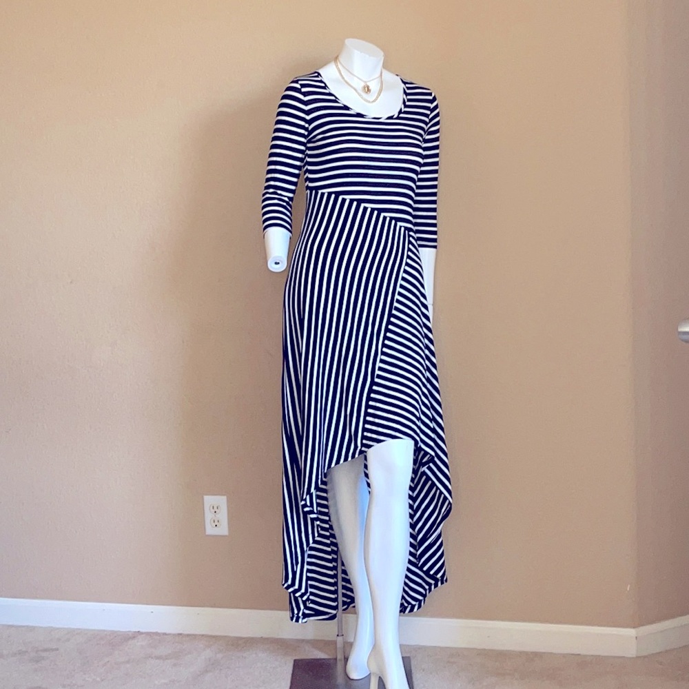 Flattering one piece Hi/Lo dress.